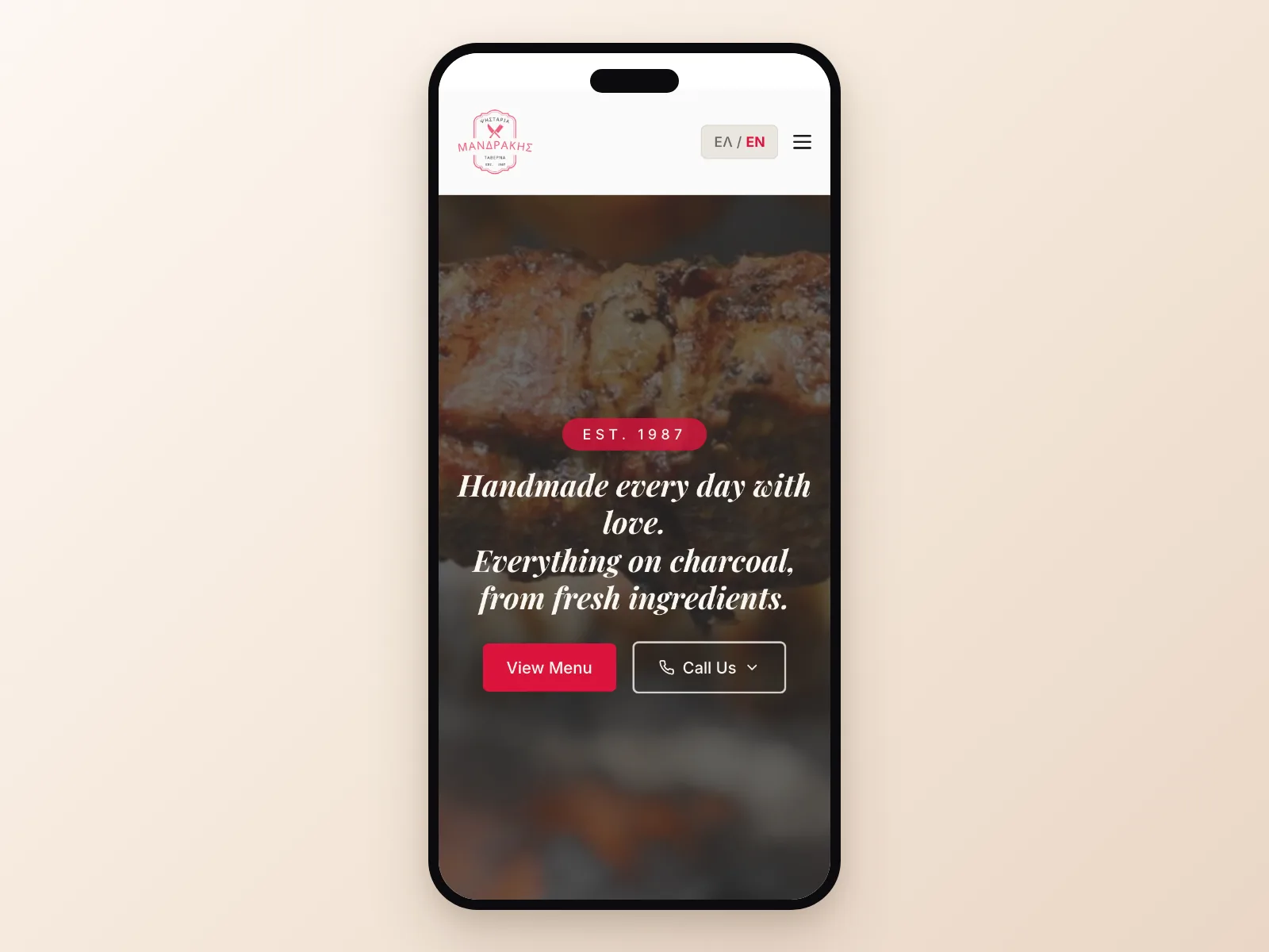 The Mandrakis restaurant website built by Zvelto, shown on a phone